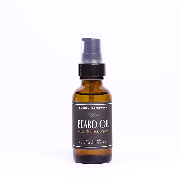 All-Natural Beard oil handcrafted by Lucky Honeybee in Jersey City, New Jersey. 
Our new beard oil is enriched with a blend of natural ingredients that offer a luxurious grooming experience for the modern man. This meticulously crafted oil incorporates the goodness of grapeseed, argan, jojoba, and fractionated coconut oil, combining their unique properties to promote healthy and lustrous facial hair. 1 ounce glass bottle 